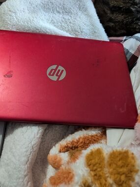 HP Red Laptop with Silver HP Logo